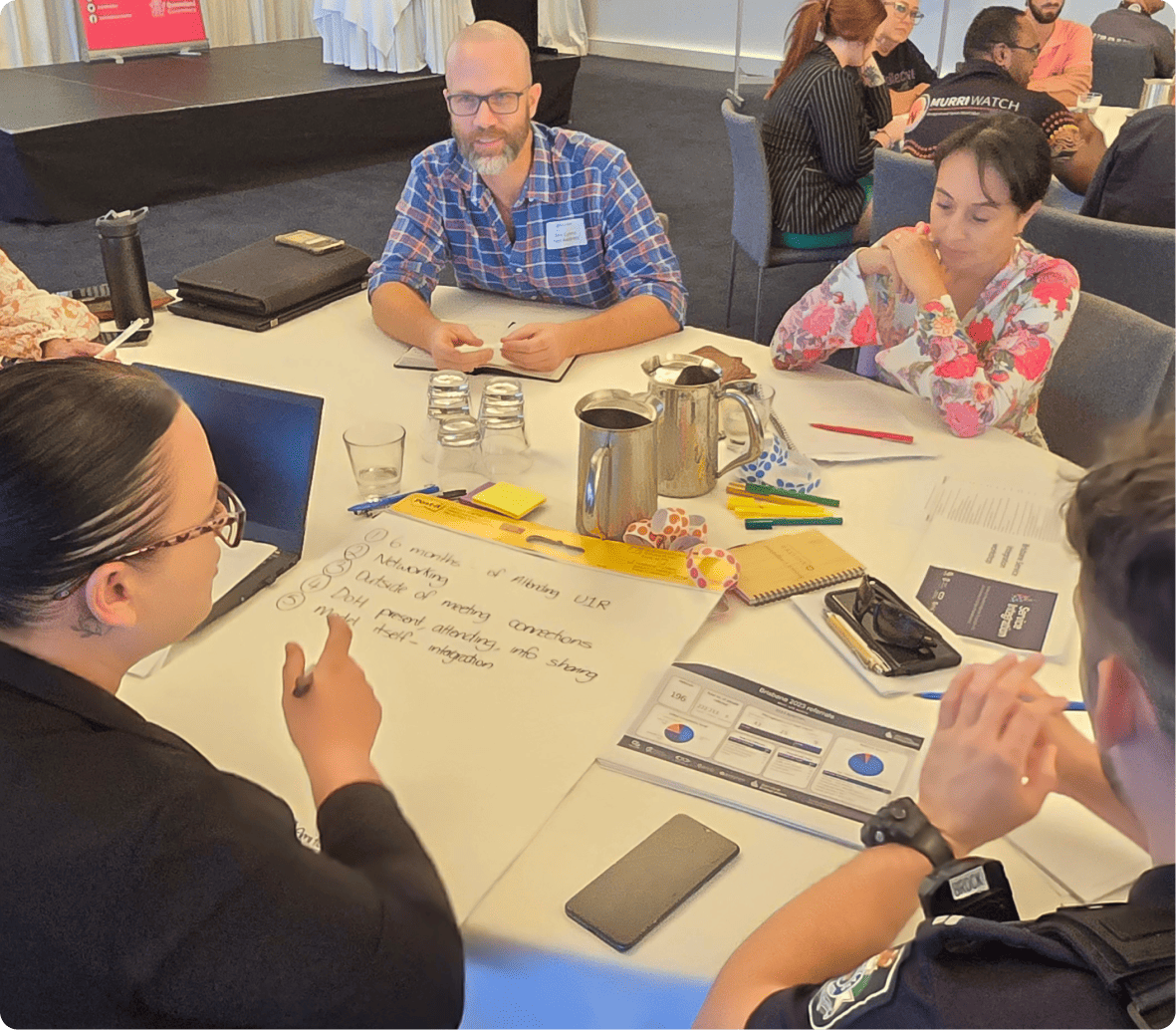 People sit around a table at a workshop