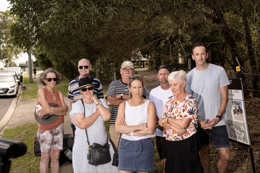 These Wakerley residents say the community was not consulted enough on a 44-unit affordable housing project. (Photo: Kenji Sato, ABC)