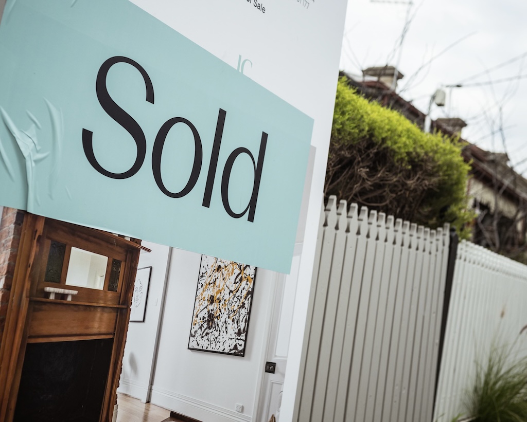 A fence with a Sold property sign in front. Photo Christopher Hopkins, AAP